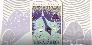 Capa do livro, ilustração em tom azul-esverdeado e as sombras em tom roxo. Uma pespectiva do alto mostra algumas casas em um campo, a do meio está coberta pela sombra de uma torre que fica no alto de uma pequena colina ao fundo. No topo o nome da autora, e na base o título do livro.