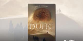 Capa do livro. Uma arte marrom acinzentada mostra 5 nativos do planeta Arrakis de pé nas areias, todos vestidos inteiramente de preto, voltados para outra pessoa bem mais à frente. Ainda mais à frente de todos, cobrindo boa parte da visão do céu cinza um enorme verme da areia mostra sua boca cheia de dentes e espalha areia ao redor. Em primeiro plano o título Duna, em branco